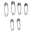Set of six metal safety pins on a white background