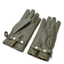 Pair of genuine German police olive leather gloves with wool lining and adjustable wrist straps for winter warmth