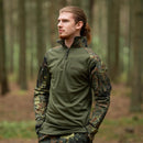 Man wearing TACGEAR German Army style Flecktarn camo combat shirt standing in a forest setting