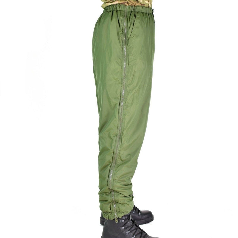 Side view of British army reversible thermal pants in green, designed for cold weather and outdoor use.