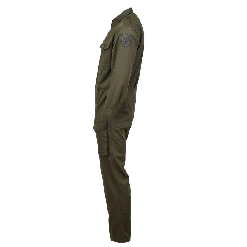 Side view of olive Austrian military mechanic coverall with cargo pockets and adjustable cuffs on white background