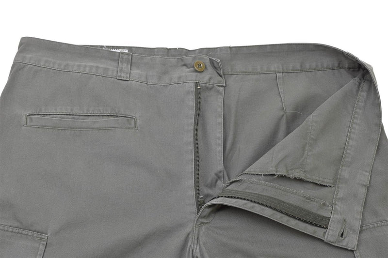 Gray French military air forces cargo pants with flat front and reinforced knees partially unzipped and buttoned waistband