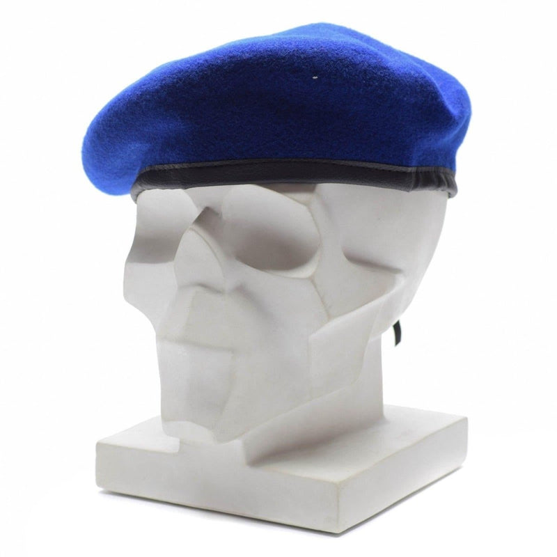 Genuine German military royal blue wool beret on a white mannequin head with black leather trim band.