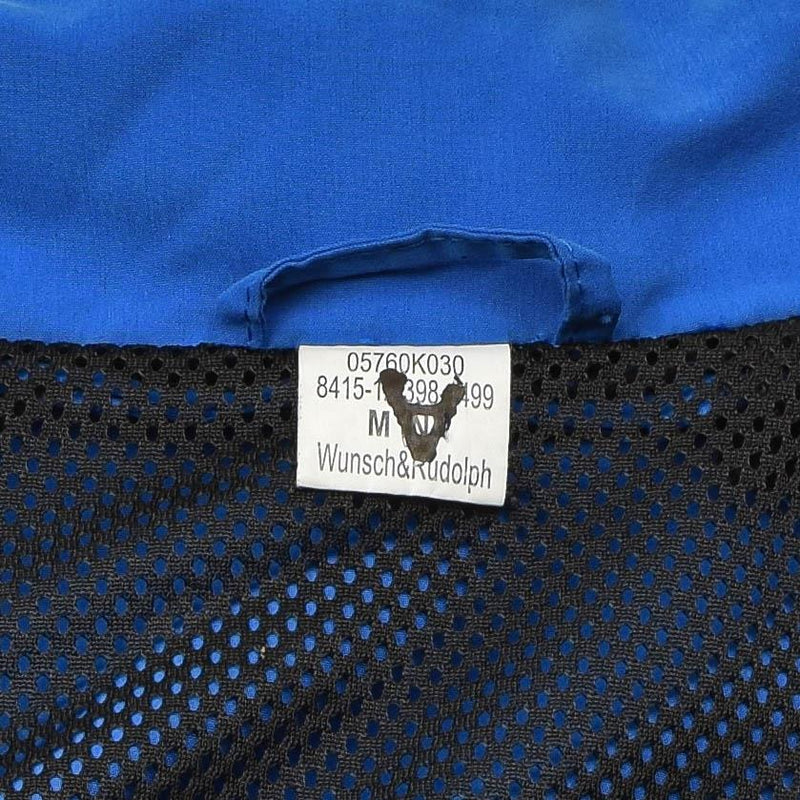 Close-up of the blue and black breathable mesh lining and label inside German Bundeswehr sports jacket size medium.