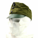 Vintage Hungarian army fatigue peaked cap with badge, olive green fabric, and a protective visor.