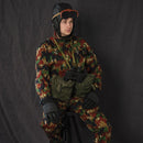 Italian army tanker in camouflage wearing vintage military helmet and genuine Italy tanker goggles with blue lenses