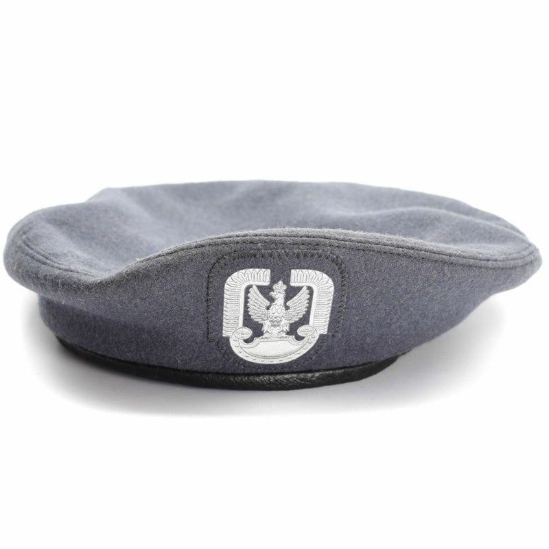 Genuine Polish military grey wool paratrooper beret with distinctive paratrooper badge, vintage air force headgear.