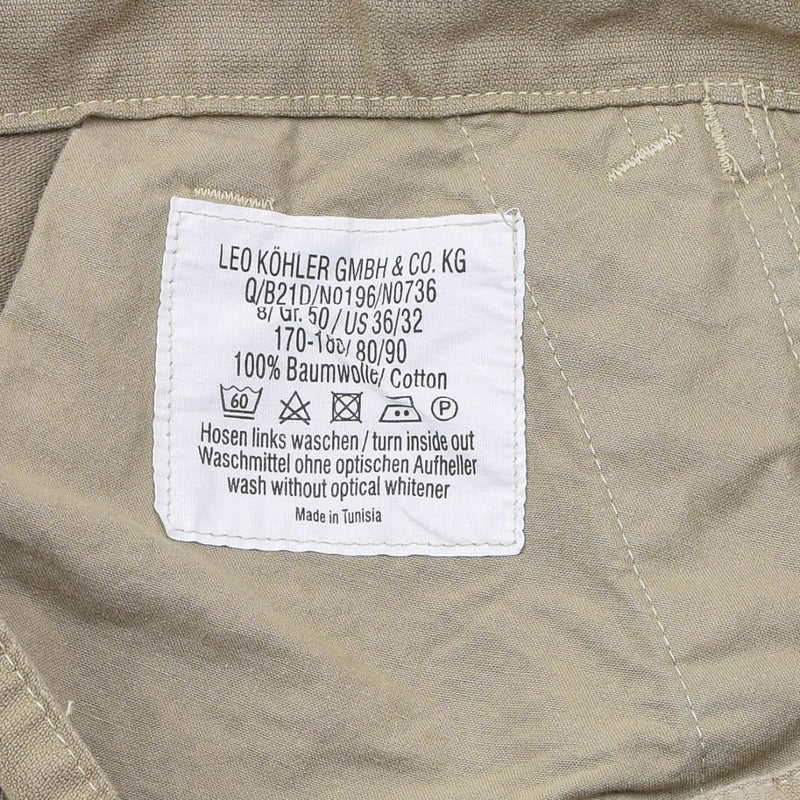 Close-up of Leo Kohler Commando trousers label showing size, cotton material, and washing instructions on khaki fabric