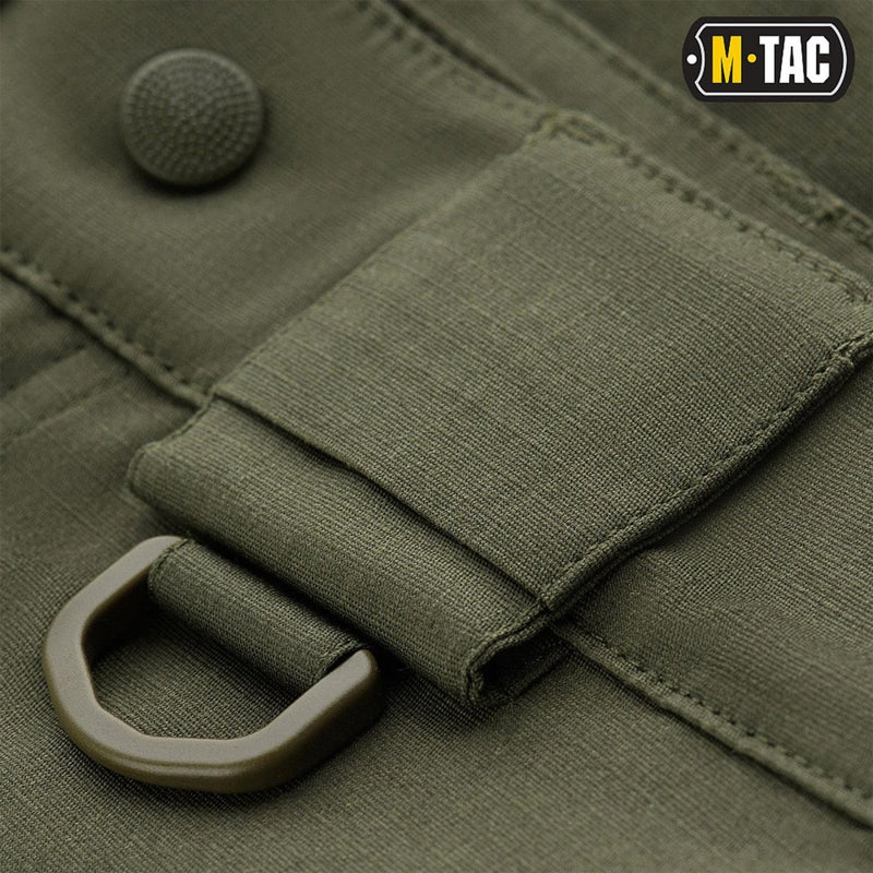Close-up of olive green M-TAC Army style Bermuda shorts showing durable fabric, belt loop, and D-ring detail.