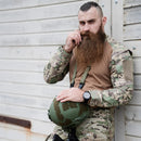 Man with long beard wearing MFH multi-terrain BDU combat tactical field shirt holding green helmet outdoors