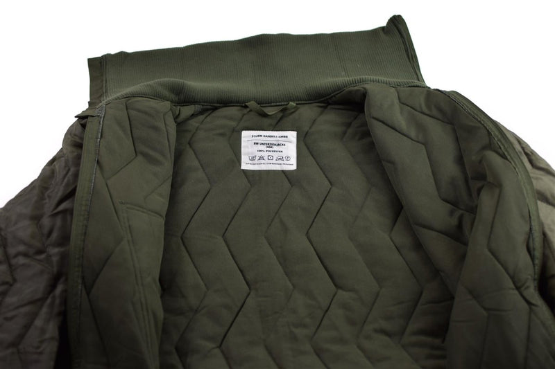 Mil-Tec German army quilted liner jacket showing detailed stitching and insulating inner fabric in olive green color