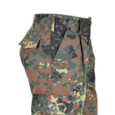 Close-up of Mil-Tec Flecktarn camo cargo field pants with multiple pockets and durable fabric.