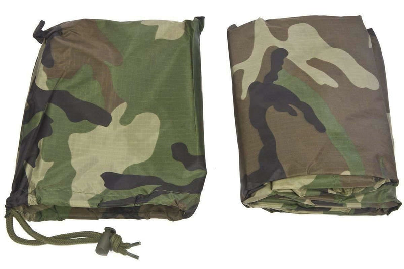Folded MIL-TEC waterproof woodland camo poncho with hood and compact carrying pouch side by side on white background