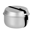Compact stacked aluminum camping cookware set secured with a black strap for easy transport and storage.