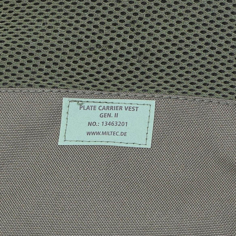 Close-up of MIL-TEC GEN II tactical plate carrier vest label in olive with mesh and durable fabric details