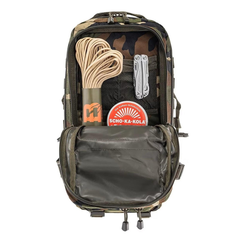 Open MIL-TEC U.S. Assault tactical backpack in woodland camo showing organized storage of gear and tools inside