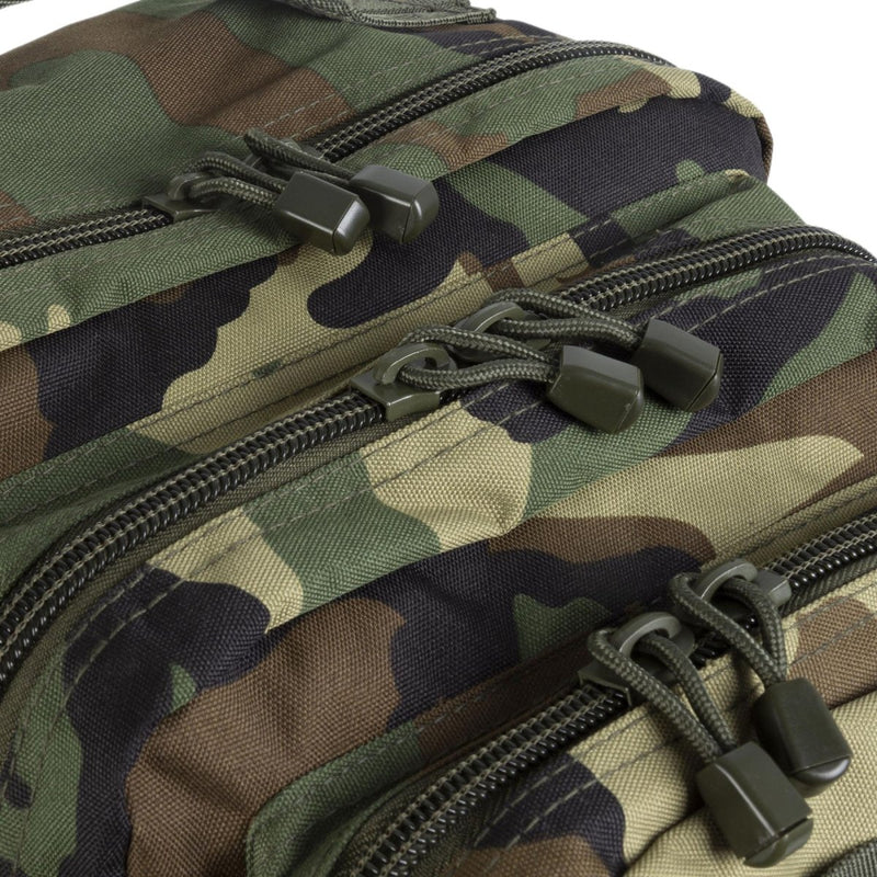 Close-up of durable woodland camo fabric and zippers on MIL-TEC U.S. Assault 36L trekking rucksack backpack