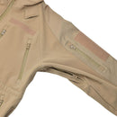 Close-up of coyote colored MIL-TEC windproof hiking soft shell jacket with zippered pockets and fleece liner.