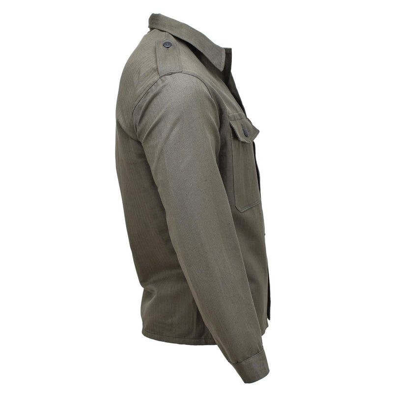 Side view of vintage olive-green Austrian M59 military field jacket with buttoned cuffs and chest pocket