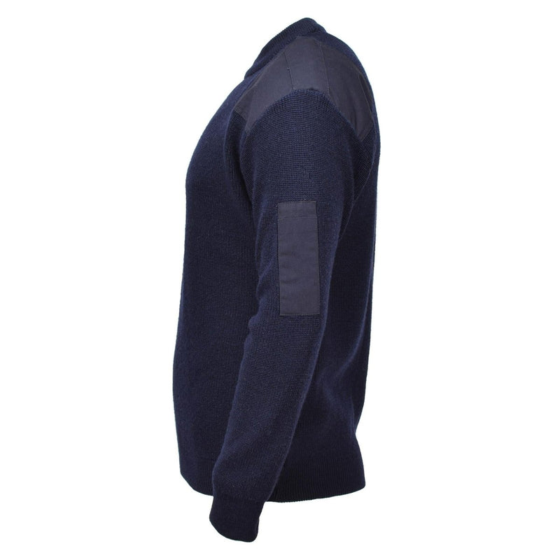 Navy blue sweater with a patch on the sleeve against a white background