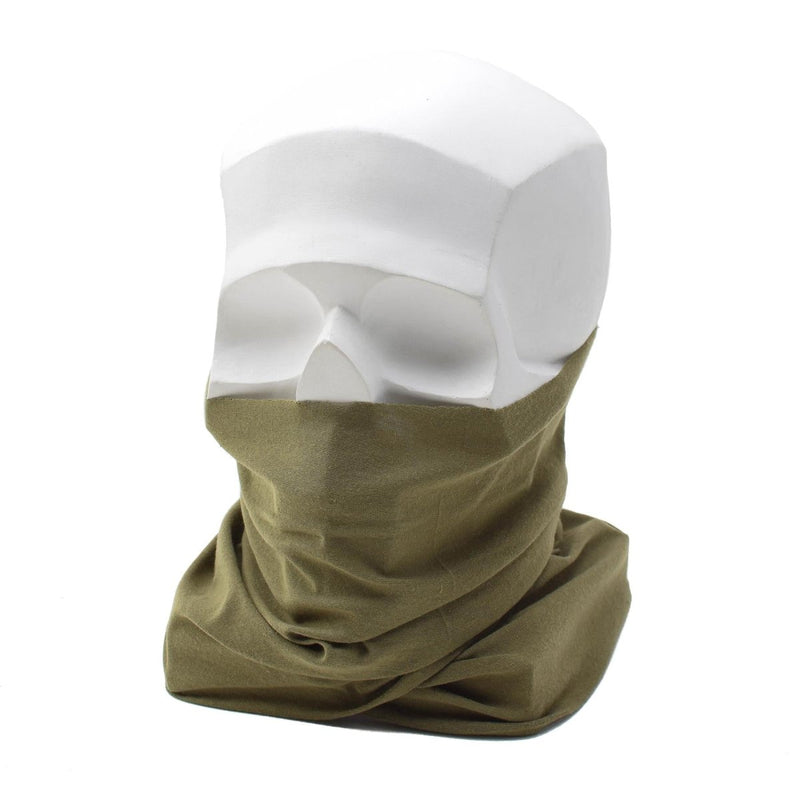 Green neck gaiter on a white mannequin head with clear plastic cover