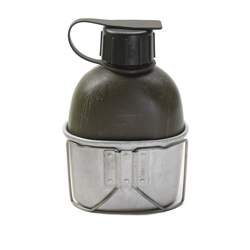 Original Danish military aluminum canteen flask with attached cup for outdoor or tactical use isolated on white background
