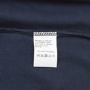 Close-up of a navy blue Dutch army t-shirt cotton fabric showing care label and stitching detail