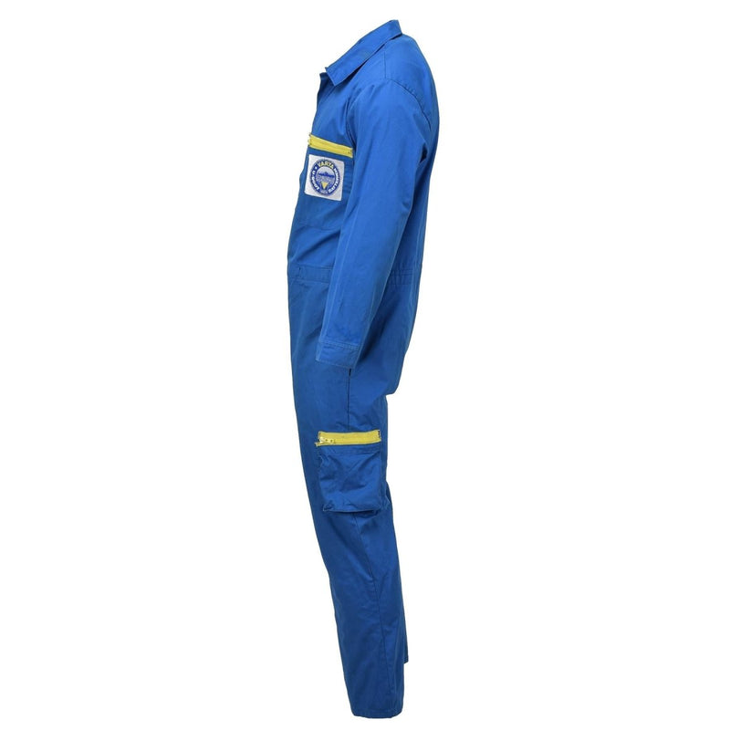Side view of blue Original German Military Bundeswehr acid-resistant coverall with yellow zipper details and patch logo