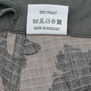 Clothing label on Hungarian military ripstop fabric pants showing care instructions and made in Hungary text.