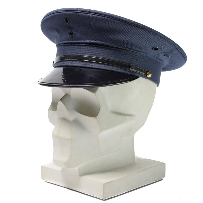 Original Korean army officer visor peaked cap in blue wool blend with black chin strap on white mannequin head.