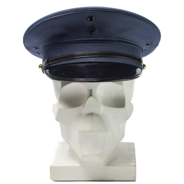 Original Korean Army officer visor peaked cap in blue wool blend with black visor and chin strap displayed on skull model