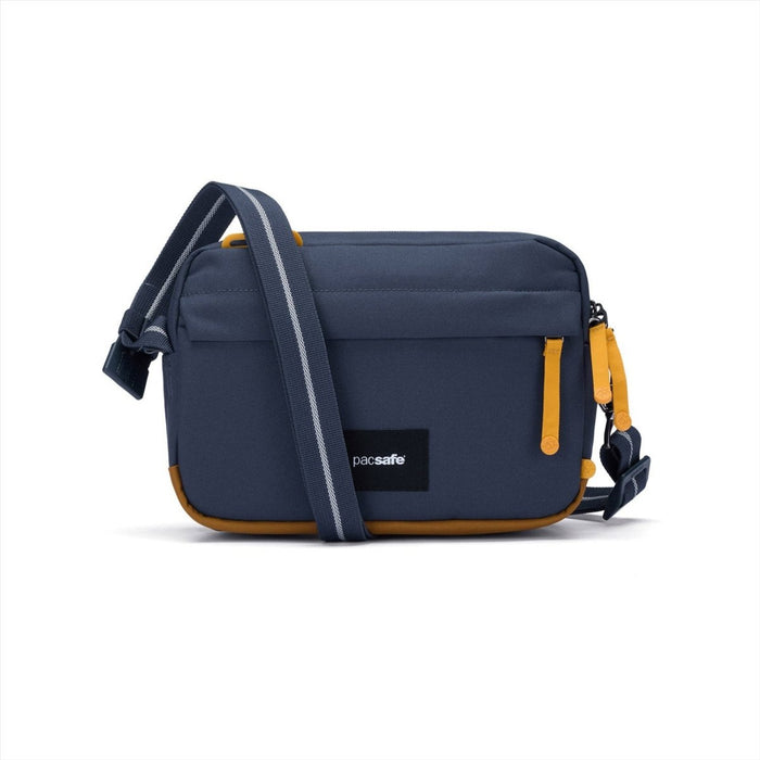 Granatowa torba na ramię Pacsafe GO Anti-Theft 2,5 l z żółtymi akcentami i regulowanym paskiem na ramię, wodoodporna