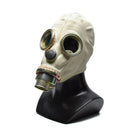 Vintage 1970s Polish MP3 gas mask made of rubber with round eyepieces and filtration canister on black display stand.